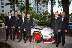 NASCAR Nationwide Series champion owner Roger Penske poses with drivers Brad Keselowski, Ryan Blaney and Joey Logano