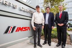 IMSA CEO Ed Bennett, IMSA and International Speedway Corporation (ISC) Chairman Jim France and NASCAR President Mike Helton unveil the addition of IMSA logos to signage outside the eight-story IMC building that is headquarters to IMSA, NASCAR and ISC