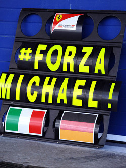 A Ferrari pit board showing support for Michael Schumacher