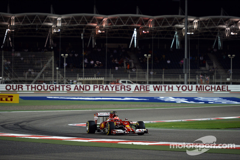 Kimi Raikkonen, Ferrari F14-T passes the Michael Schumacher corner where a message of support is dis