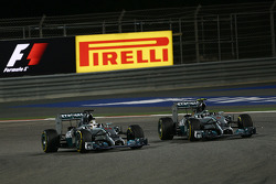 (L to R): Lewis Hamilton, Mercedes AMG F1 W05 and team mate Nico Rosberg, Mercedes AMG F1 W05 battle for position