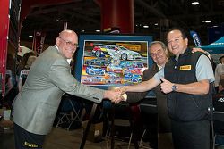 Scott Bove, Hector Cademartori and Rafael Navarro unveil the 25th anniversary poster of the series