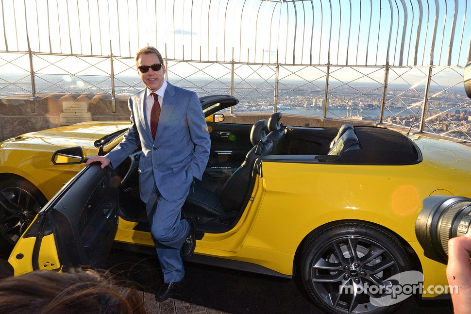 Bill Ford with a Ford Mustang convertible built on the 86th floor of the Empire State Building to celebrate the brand's 50th anniversary