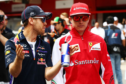 (L to R): Sebastian Vettel, Red Bull Racing with Kimi Raikkonen, Ferrari on the drivers parade