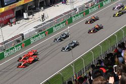 Sebastian Vettel, Ferrari SF71H and Kimi Raikkonen, Ferrari SF71H lead at the start of the race