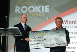Mario Andretti accepts Kurt Busch’s $5,000 check for being the 2014 Indianapolis 500’s fastest rookie Anne Proffit photo