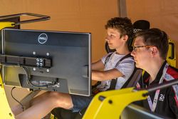 Fans enjoying the racing simulator at scrutineering
