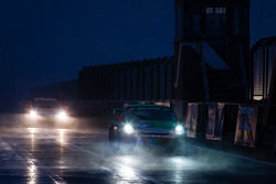 #57 Porsche 997 Cup: André Krumbach, Andreas Riedl, Ivan Reggiani enters pitlane under the rain and fog