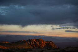 The sun rises above Pikes Peak