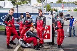 Audi Sport Team Joest team members wait for the crashed #1 Audi Sport Team Joest Audi R18 E-Tron Quattro