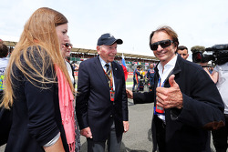 John Surtees, with Emerson Fittipaldi, on the grid