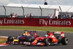 Fernando Alonso, Ferrari F14-T and Sebastian Vettel, Red Bull Racing RB10 battle for position