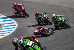 Riders dodge the bike of Davide Giugliano