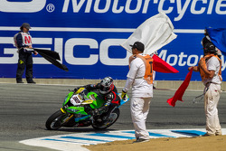 Corner workers celebrate the end of race 2