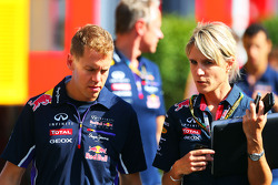 (L to R): Sebastian Vettel, Red Bull Racing with Britta Roeske, Red Bull Racing Press Officer