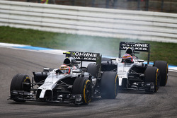 Kevin Magnussen, McLaren MP4-29 leads team mate Jenson Button, McLaren MP4-29