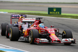 Fernando Alonso, Ferrari F14-T and Sebastian Vettel, Red Bull Racing RB10 battle for position