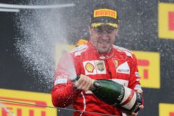 Fernando Alonso, Ferrari celebrates his second position with the champagne on the podium