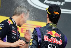 Daniel Ricciardo, Red Bull Racing celebrates with the champagne with Paul Monaghan, Red Bull Racing Chief Engineer on the podium