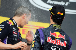 Daniel Ricciardo, Red Bull Racing celebrates with the champagne with Paul Monaghan, Red Bull Racing Chief Engineer on the podium