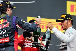 Lewis Hamilton, Mercedes AMG F1 and third placed Lewis Hamilton, Mercedes AMG F1 celebrate with the champagne on the podium