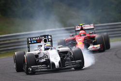 Felipe Massa, Williams FW36 leads Kimi Raikkonen, Ferrari F14-T