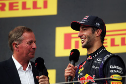 Daniel Ricciardo, Red Bull Racing on the podium with Martin Brundle, Sky Sports Commentator