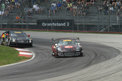 Ryan Dalziel, Porsche 911 GT3 and Johnny O'Connell, Cadillac CTS-V.R battle for the lead