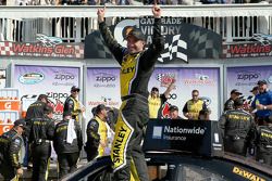 Marcos Ambrose celebrates
