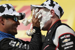 Race winner Will Power gets a face full of cream puff from second place Juan Pablo Montoya