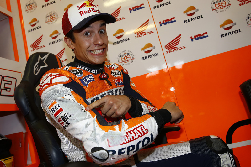 Marc Marquez, Repsol Honda Team shows off the scraped suit after nearly falling off