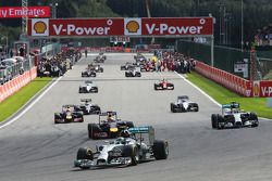 Nico Rosberg, Mercedes AMG F1 W05 leads away on the formation lap as Ferrari mechanics on the grid work on the Ferrari F14-T of Fernando Alonso, Ferrari