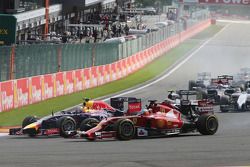 Fernando Alonso, Ferrari F14-T and Daniel Ricciardo, Red Bull Racing RB10 at the start of the race