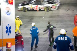 Denny Hamlin throws his HANS device at Kevin Harvick after crashing out