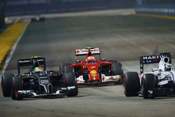 Kimi Raikkonen, Ferrari F14-T, and Esteban Gutierrez, Sauber C33, and Felipe Massa, Williams FW36 (Right)