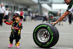 A young fan with a Pirelli tyre