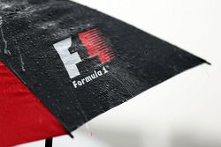 Rain falls on an F1 umbrella