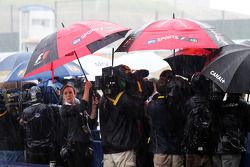 The media in a wet and rainy paddock