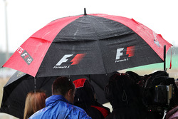The media in a wet and rainy paddock