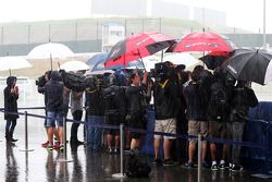 The media in a wet and rainy paddock