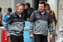 (L to R): Jonathan Neale, McLaren Chief Operating Officer and Eric Boullier, McLaren Racing Director in a wet and rainy paddock