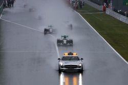 Nico Rosberg, Mercedes AMG F1 W05 leads the start of the race behind the FIA Safety Car