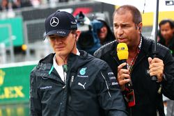 Nico Rosberg, Mercedes AMG F1 with Kai Ebel, RTL TV Presenter on the grid