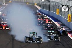 Nico Rosberg, Mercedes AMG F1 locks up under braking beside team mate Lewis Hamilton, Mercedes AMG F1 W05 at the start of the race