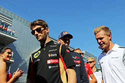 Romain Grosjean, Lotus F1 Team with Kevin Magnussen, McLaren on the drivers parade