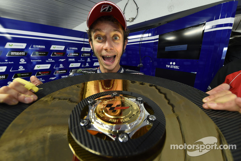 Race winner Valentino Rossi celebrates