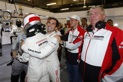 Romain Dumas and Neel Jani celebrate pole position