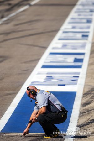 Pirelli technician takes a track temperarure reading