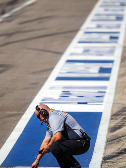 Pirelli technician takes a track temperarure reading
