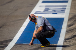 Pirelli technician takes a track temperarure reading